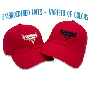 May include: Two red baseball caps with embroidered Cars logos. One logo is white and the other is black.