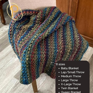 May include: A crocheted blanket featuring a variegated yarn pattern in shades of blue, green, gold, and burgundy. The text lists 8 sizes: Baby Blanket, Lap/Small Throw, Medium Throw, Large Throw, X-Large Throw, Twin Blanket, Queen Blanket, King Blanket.