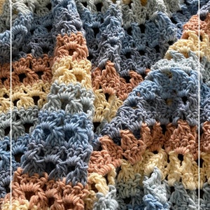 May include: A crocheted blanket with a textured pattern in shades of blue, yellow, and pink. The blanket is folded in half and the edges are visible. The text "Patternprincess.com" is visible in the bottom right corner.