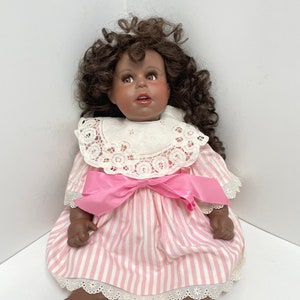 Vintage-African American porcelain baby doll With Curly Hair-Collectible
