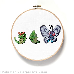 May include: A cross-stitch pattern of the Pokemon Caterpie evolution line. The pattern shows Caterpie, Metapod, and Butterfree in a row. The Pokemon are in their classic pixelated style.
