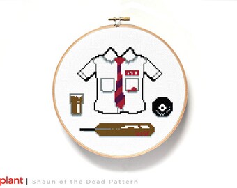 May include: Cross-stitch pattern featuring a white shirt with a red tie, a glass of brown liquid, a black record, and a brown bat. The shirt has a red name tag with the text "Ed" on it. The pattern is titled "Shaun of the Dead Pattern".