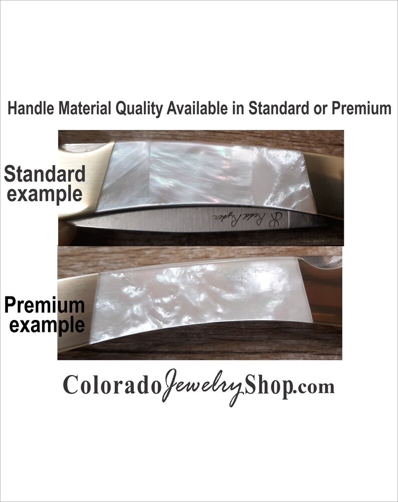 May include: Close-up of two knife handles showing the difference between standard and premium materials. The standard handle is a white pearlescent material with a subtle shimmer. The premium handle is a white pearlescent material with a more pronounced swirl pattern. The text "raphy ppy R" is visible on the standard handle. The text "Colorado Jewelry Shop.com" is visible at the bottom of the image.