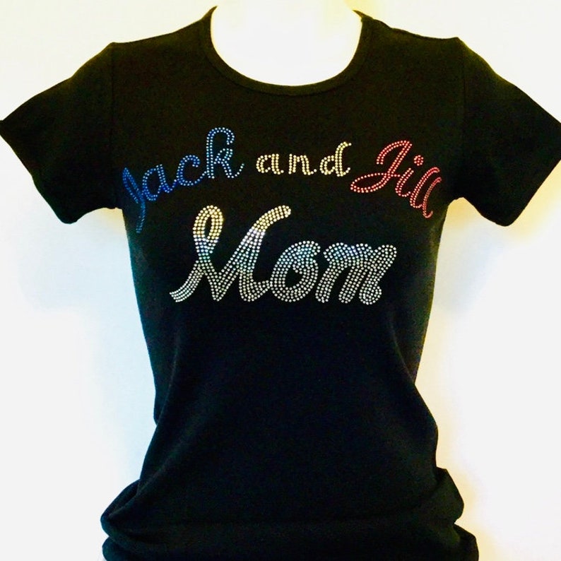 May include: Black t-shirt with the words "Jack and Jill Mom" in rhinestones. The rhinestones are in blue, red, and silver.