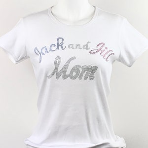 May include: White t-shirt with the text "Jack and Jill Mom" in rhinestones.
