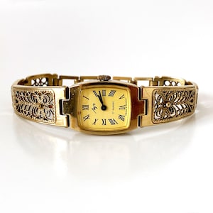Gouden dameshorloge. Vintage dameshorloge, mechanisch dameshorloge, dameshorloge met kleine pols 'Luch', sierlijk gouden horloge