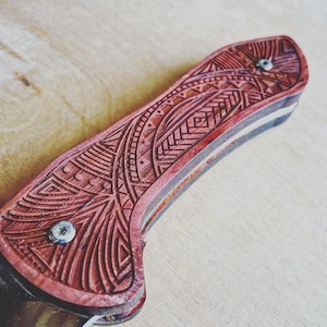 Custom engraved knife with Polynesian design. Made as a one off.