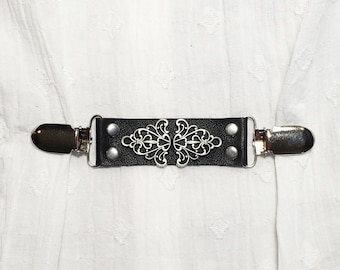 Black leather cinch clip, dress clip, jacket clip, shirt clip, sweater clip skirt clip, silver tone filigree center piece and clips Last one