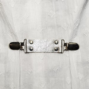Silver metallic leather cinch clip, dress clip, jacket clip, shirt clip, sweater clip, skirt clip, with silver tone clips. DIY tailoring.