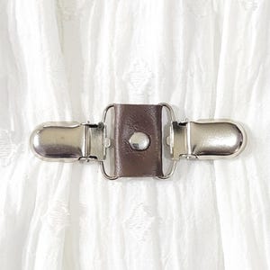 Brown leather mini cinch clip w/ silver tone clips. Dress clip, jacket clip, shirt clip, sweater clip, skirt clip, cloak clip. DIY tailor