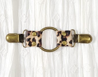 Cheetah animal print leather w/ bronze tone o ring cinch clip. Shirt clip, dress clip, sweater clip, skirt clip, jacket clip, cloak clip