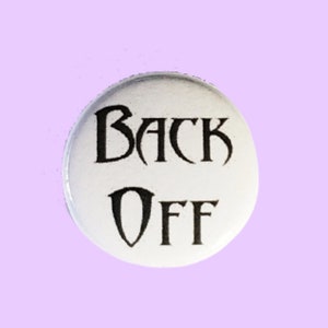 May include: White button with black text that reads "Back Off".