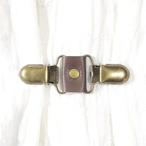 Brown leather mini cinch clip, w/ bronze tone clips. Dress clip, jacket clip, shirt clip, sweater clip, skirt clip, cloak clip. DIY tailor