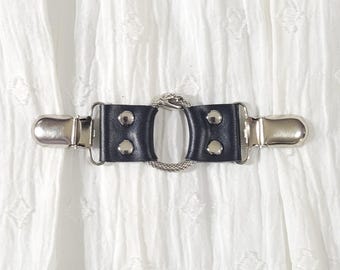 Black leather cinch clip w/ small silver tone infinity snake o-ring & clips. Shirt clip, dress clip, sweater clip, skirt clip, jacket clip.