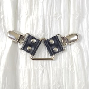 Silver tone triangle ring cinch clip w/ black leather. Shirt clip, dress clip, sweater clip, skirt clip, jacket clip, cloak clip. DIY tailor