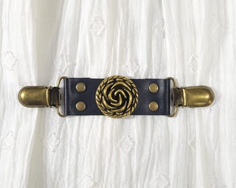 Black leather cinch clip w/ bronze tone rose conch & clips. Dress clip, jacket clip, shirt clip, sweater clip, skirt clip, cloak clip.