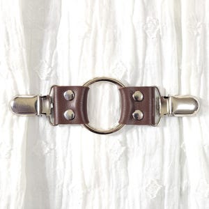 Brown leather cinch clip w/ medium silver tone oring. Shirt clip, dress clip, sweater clip, skirt clip, jacket clip, cloak clip. DIY tailor.