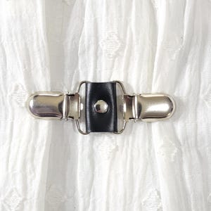 Black leather mini cinch clip w/ silver tone clips. Dress clip, jacket clip, shirt clip, sweater clip, skirt clip, cloak clip. DIY tailoring