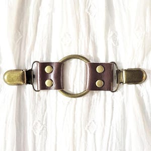 Brown leather w/ bronze tone oring cinch clip. Shirt clip, dress clip, sweater clip, skirt clip, jacket clip, cloak clip. DIY tailoring