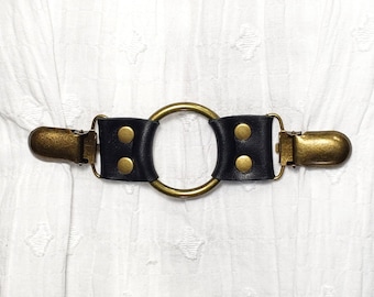 Black leather cinch clip w/ medium bronze tone oring. Shirt clip, dress clip, sweater clip, skirt clip, jacket clip, cloak clip. DIY tailor.