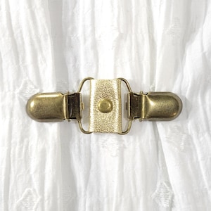 Gold metallic leather cinch clip w/ bronze tone clips. Dress clip, jacket clip, shirt clip, sweater clip, skirt clip, cloak clip. DIY tailor