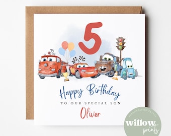 May include: A birthday card featuring cartoon cars, a large red number 5, and the text "Happy Birthday to our special son Oliver." The card has a brown border and a watercolor style.