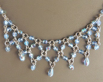 1928 Company Necklace - choker length with light blue beads; silver