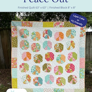May include: A quilt pattern called "Peace Out" featuring a white background with colorful peace sign blocks. The quilt is 63 inches by 63 inches and the blocks are 8 inches by 8 inches. The pattern is suitable for layer cakes or fat quarters.