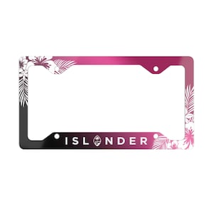 May include: A pink and black license plate frame with a white floral design and the word "ISLANDER" in white text. The frame features a small logo of a palm tree and a sun.