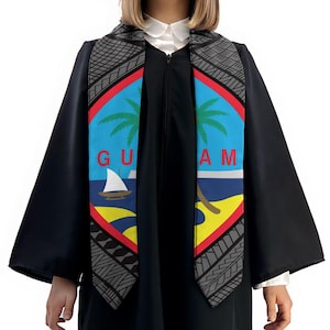 May include: A black graduation stole with a gray and white pattern. The stole features the flag of Guam, which includes a blue background with a sailboat, palm tree, and the word "GUAM" in white letters.