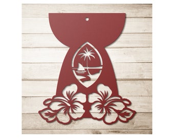 May include: A maroon metal wall art piece featuring a tropical island scene with a palm tree, sailboat, and hibiscus flowers. The design includes a cutout of a beach scene and two hibiscus flowers at the bottom. A small hole is at the top for hanging.