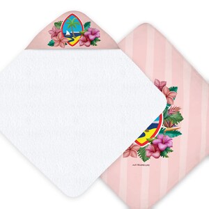 May include: White hooded baby towel with a pink and white striped backing. The hood features a colorful design with flowers, a palm tree, and a sailboat. The towel has the text "ISLAND LIFE".