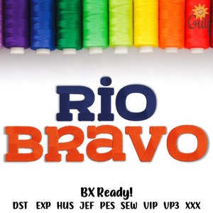 May include: An embroidery design featuring the text RIO BRAVO with RIO in dark blue and BRAVO in orange. Above the text is a row of colorful thread spools in pink, purple, blue, green, lime, yellow, orange, and red. Text below reads BX Ready! DST EXP HUS JEF PES SEW VIP UP3 XXX.