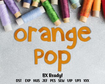 May include: An embroidery design file featuring the orange text "orange POP" in a bold, sans-serif font. Above the text are several colorful spools of thread. Below the text, the words "BX Ready!" appear, followed by a list of file formats: DST, EXP, HUS, JEF, PES, SEW, VIP, VP3, and XXX.