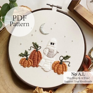 May include: Embroidered Halloween-themed hoop art featuring a ghost, pumpkins, and a crescent moon. The design includes the text "PDF Pattern" and "No A.I. This Shop Is AI Free! Support True Handmade."