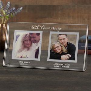 May include: A clear glass photo frame with two pictures. The top of the frame reads "30th Anniversary" in cursive. The bottom of the frame has the text "Jim & Karen 1993-2025" and "Loved You Then, Love You Still".
