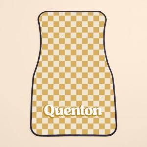 May include: A yellow and white checkered car floor mat with the name "Quenton" in a retro font.