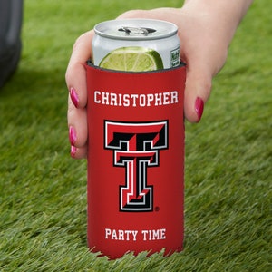 May include: Red and black can cooler with the Texas Tech University logo and the text "PARTY TIME". The cooler has a white name "CHRISTOPHER" printed on it.