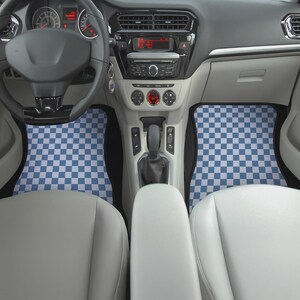 May include: Checkered blue and white car floor mats in a car interior. The mats are in the front passenger and driver's side of the car.