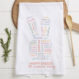 May include: White kitchen towel with a colorful word cloud of names, including Joshua, Samantha, Amelia, Benjamin, and Kennedy. The text "Happy Easter The Anderson Family" is printed below the word cloud.