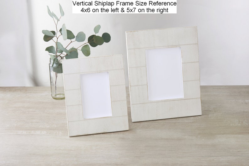 May include: Two white vertical shiplap picture frames, one 4x6 inches and one 5x7 inches, on a light wood surface.