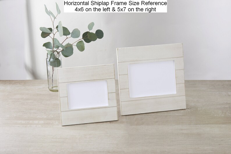 May include: Two whitewashed wood picture frames with a shiplap design. The frame on the left is 4x6 inches and the frame on the right is 5x7 inches.