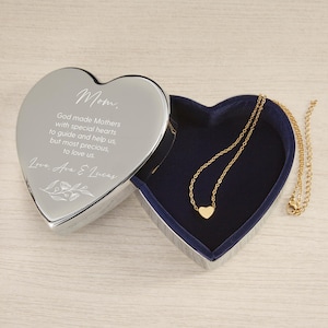 May include: Silver heart-shaped trinket box with a blue velvet interior. The lid is engraved with the text "Mom. God made Mothers with special hearts to guide and help us, but most precious, to love us. Love. Ava & Lucas".