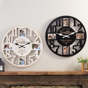 May include: Two decorative clocks with photo frames. One is white, the other black. Both have cut-out numbers and the words "Our Love is Timeless." The white clock says "Cory & Jade Always & Forever." The black clock says "Andrew & Jenna May 23, 2025."