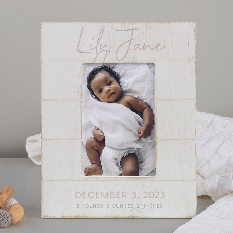 May include: White wooden picture frame with a photo of a baby girl. The frame has the name "Lily Jane" written in pink script and the date "December 3, 2023" with the baby's birth weight and length.