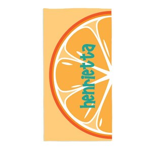 May include: Orange beach towel with a half orange slice design and the name "Henrietta" written in teal.