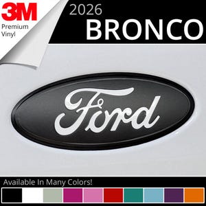 May include: Black oval Ford Bronco emblem with white "Ford" script. The image includes the text "2026 BRONCO" and "Available In Many Colors!" The top left corner shows "3M Premium Vinyl".