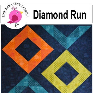 Könnte beinhalten: Diamond Run Quiltmuster mit einem sich wiederholenden Diamantenmuster in orange, gelb, türkis, lila und marineblauen Stoffen. Das Muster wird als schnell und einfach beschrieben.