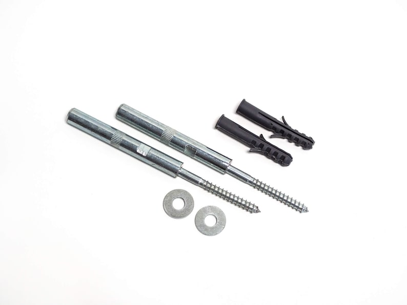 May include: Two silver screws with a threaded end and a flat head, two black plastic wall anchors, and two silver washers.