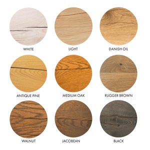 May include: Nine wood stain color samples in round circles. The colors are white, light, Danish oil, antique pine, medium oak, rugger brown, walnut, Jacobean, and black.